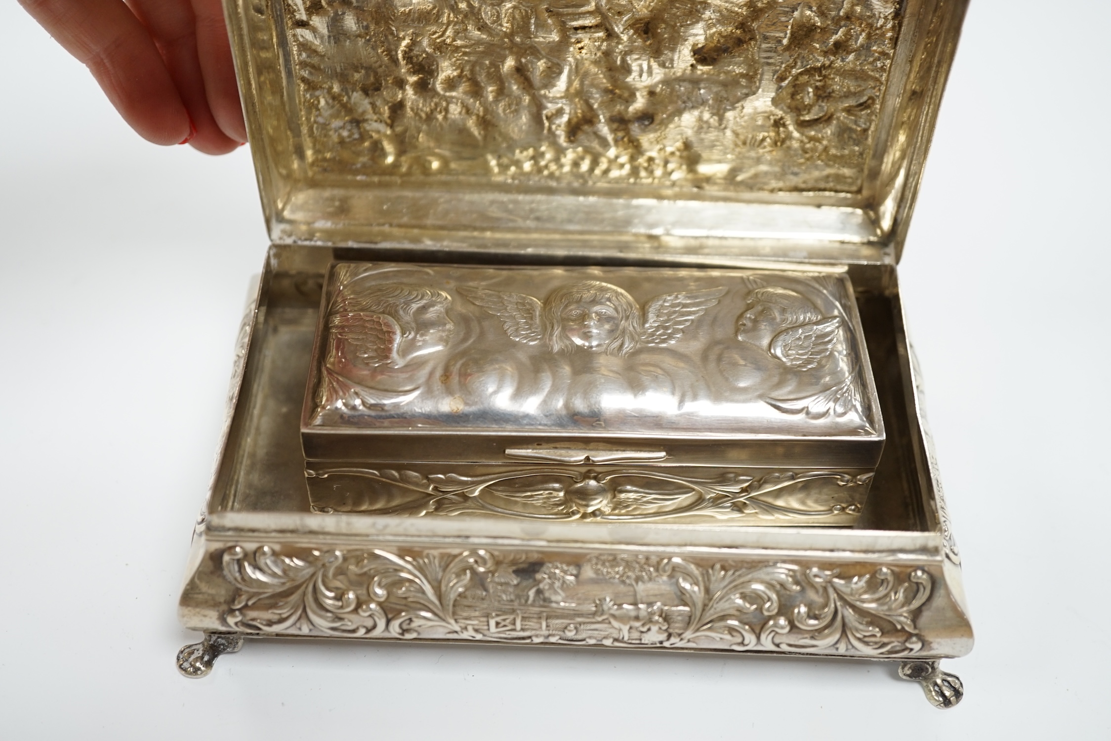 A late 19th century Dutch white metal bombe shaped rectangular trinket box, 14cm, together with an Edwardian silver trinket box, London, 1908.